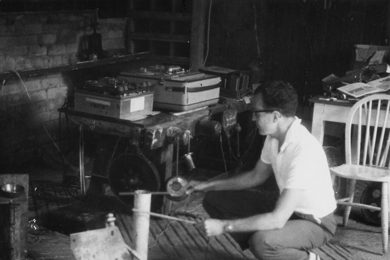Douglas Lilburn recording sounds in a barn, Wiltshire, England - Photograph taken by Peter Russell Crowe